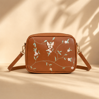 Floral Embroidered Crossbody Bag with Butterfly Charm Brown